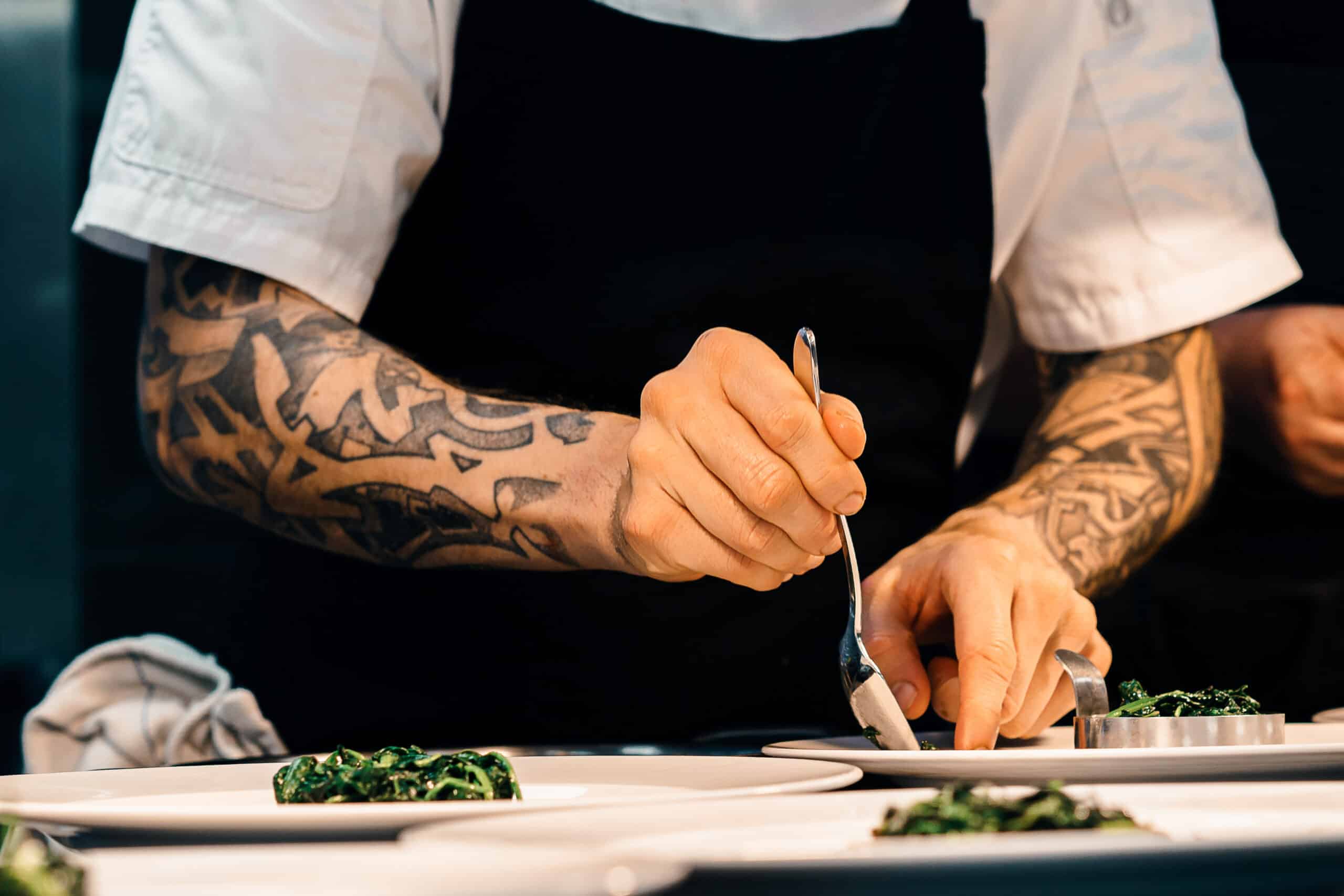 A chef plating a meal they created