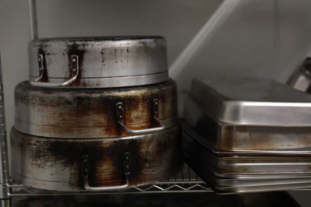 A collection of cooking stainless kitchenware